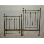 A Victorian brass single bed with original irons and wooden base bearing the plaque for James