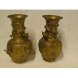 Two Japanese brass/bronze tapered vases with raised dragon decoration,