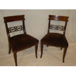 A pair of 19th Century inlaid mahogany dining chairs with pierced rail backs and upholstered seats
