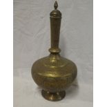 A Middle Eastern brass tapered vase and cover decorated all over with animals and foliage,