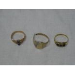 A 9ct gold dress ring set three sapphires,