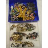 A large selection of various costume jewellery including necklaces, brooches,