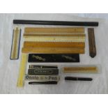 A selection of various collector's rulers including ebony parallel rule,