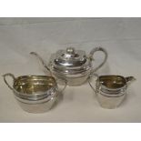A good quality silver plated three-piece oval tea set with scroll decorated handles