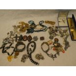 A large selection of various costume jewellery including silver brooches, necklaces,