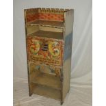 An unusual painted wood music-style cabinet with open shelves and central compartment enclosed by a
