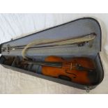 A Stradivarius copy violin with 14" two-piece back in fitted case with bows