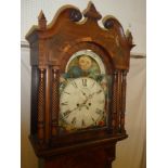 A 19th Century longcase clock with 13½" painted arched dial with moon phase aperture,