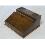 A small late Victorian walnut rectangular desk stand with compartment enclosed by a hinged sloping