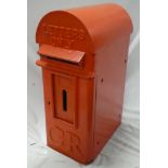 An old cast iron arched postbox, the front marked "Letters Only GR",