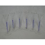 A set of six good quality liqueur goblets with blue and white air twist stems on circular bases,