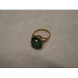 A 9ct gold dress ring set a green stone