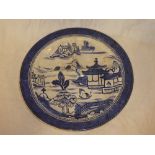 An Ashworth pottery circular serving dish with blue and white Eastern scene decoration