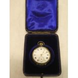 A ladies silver cased fob watch with circular enamelled dial in velvet lined case