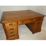 A good quality reproduction polished wood rectangular partner's desk with three drawers in the