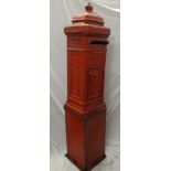 A good quality painted metal square postbox with relief decoration on square plinth,