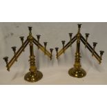 A pair of good quality brass rise-and-fall seven section candelabra with adjustable branches and