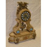 A 19th Century French mantel clock with circular dial and individual porcelain numerals in gilt
