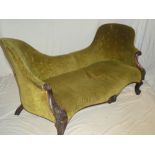 A Victorian rosewood double scroll end chaise longue upholstered in green fabric on scroll shaped