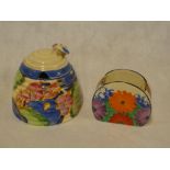 A Clarice Cliff Bizarre "Beehive" pattern preserve jar and cover with painted floral decoration and