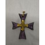 An unusual gold crucifix pendant mounted with amethyst arms,