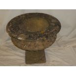 An old weathered composition pedestal garden urn,