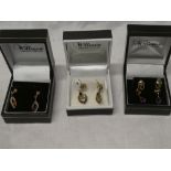 Three pairs of 9ct gold earrings including sapphire and amethyst mounted examples