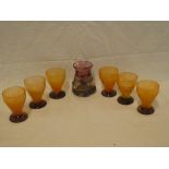 A set of six Daum Nancy glass orange and purple tinted goblets and an Art Glass purple tinted