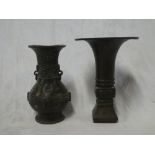 Two Japanese bronze tapered vases with raised decoration, signed,