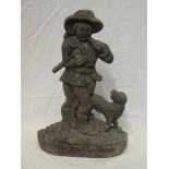 An old cast iron door stop in the form of a traveller with dog