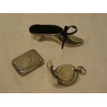A late Victorian silver pin cushion in the form of a shoe,