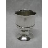 A good quality modern silver circular pedestal egg cup,