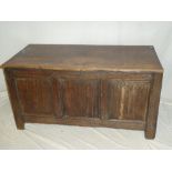 An 18th Century oak rectangular coffer with triple panelled front and hinged lid (af)
