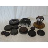 A selection of Eastern carved wood vase stands,