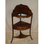 A 19th Century mahogany corner wash stand with bowl recess above two tiers,