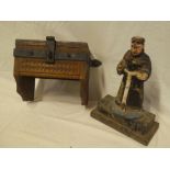 An old carved oak and iron mounted wall mounted candle box with hinged lid and a carved wood and