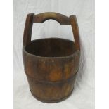 An old rustic circular well bucket