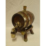 A good quality oak drinks barrel with silver plated mounts and stand bearing presentation text "B.M.