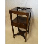 A 19th Century mahogany square wash stand with bowl recess and central drawer on square legs