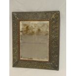 A 19th Century bevelled rectangular wall mirror in rectangular frame with silver plated scroll and