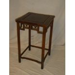 A Chinese rosewood square occasional table with decorated frieze on turned supports