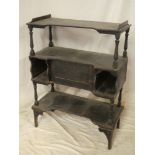 A 19th Century stained pine open shelving unit with central cupboard enclosed by a small panelled