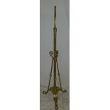 An old brass lamp standard base with scroll decoration