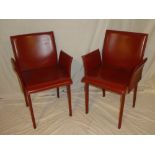 A pair of vintage-style occasional chairs upholstered in vinyl