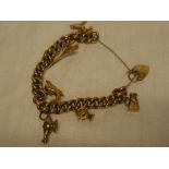 A 9ct gold chain link charm bracelet mounted with six 9ct gold and other charms