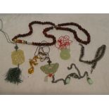 A selection of various costume jewellery including beadwork necklaces, jade pendants,