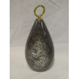 A Cornish serpentine globular-shaped door stop with brass ring handle,