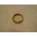 A large 9ct gold wedding band