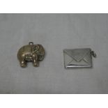 A George V silver charm in the form of an elephant,