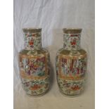 A pair of late 19th Century Cantonese pottery tapered vases with painted figure and floral